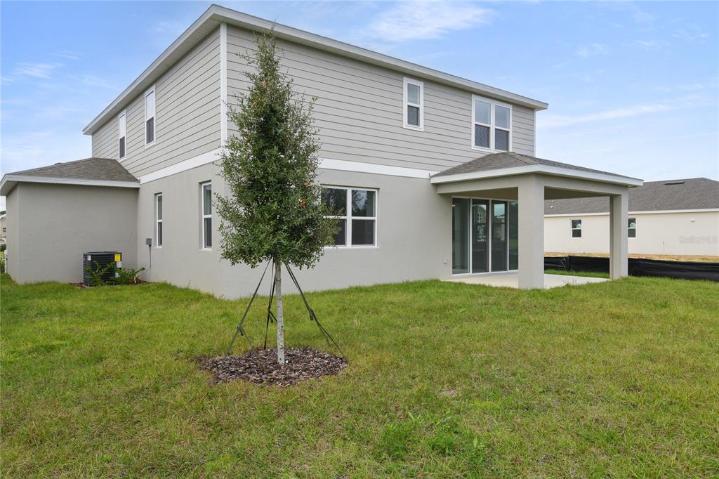 158 Waterstone Loop Tavares, FL 32778 - Photo 20 of 20 a front view of a house with a garden