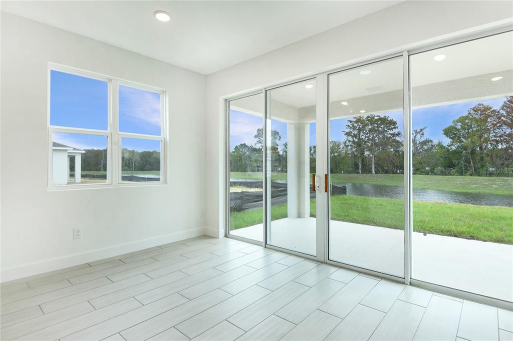 158 Waterstone Loop Tavares, FL 32778 - Photo 6 of 20 a view of an empty room and window
