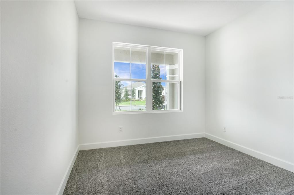 158 Waterstone Loop Tavares, FL 32778 - Photo 8 of 20 an empty room with a window