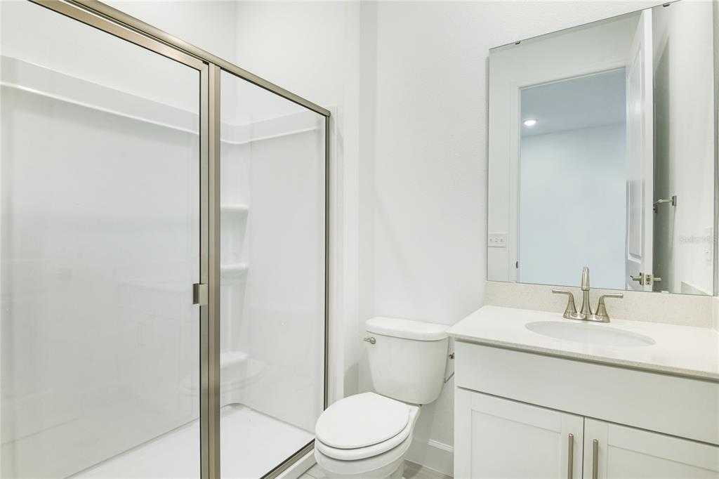158 Waterstone Loop Tavares, FL 32778 - Photo 9 of 20 a bathroom with a sink a toilet and shower