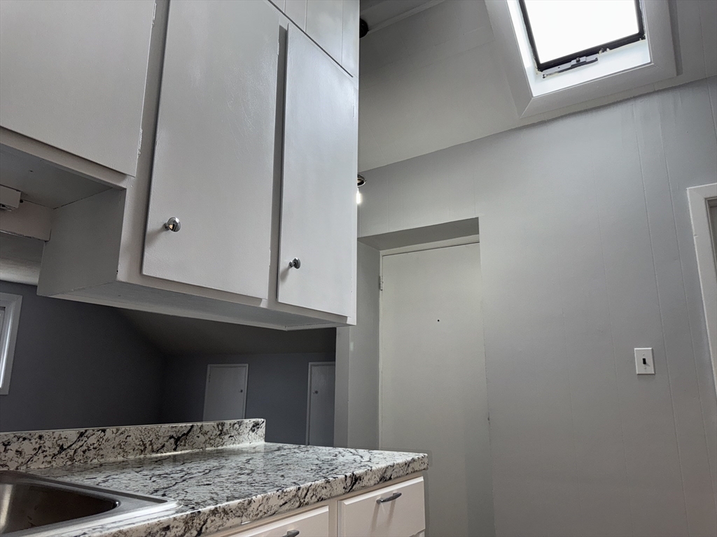 148 Maxfield Street, Unit 3 New Bedford, MA 02740 - Photo 11 of 21 a view of kitchen with cabinets