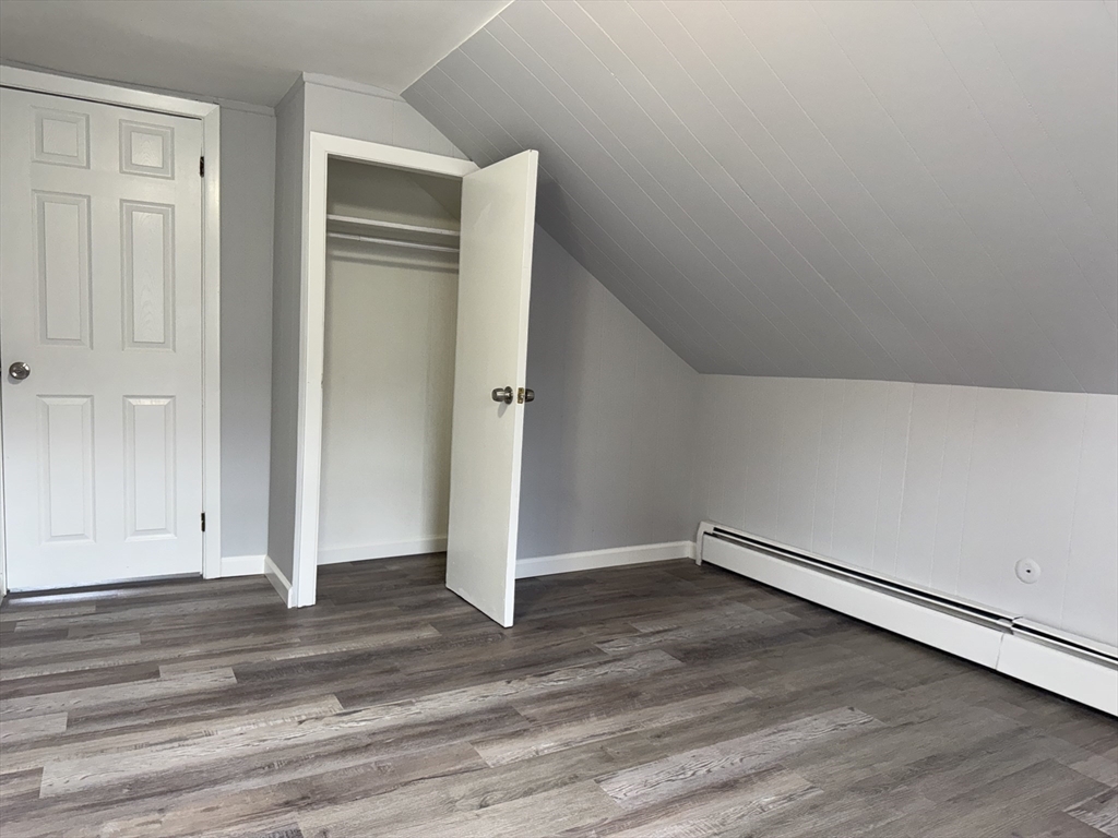 148 Maxfield Street, Unit 3 New Bedford, MA 02740 - Photo 14 of 21 an empty room with wooden floor
