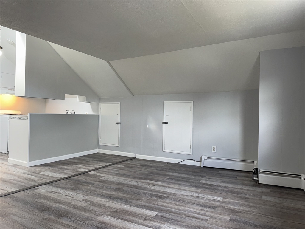 148 Maxfield Street, Unit 3 New Bedford, MA 02740 - Photo 5 of 21 a view of a room with wooden floor