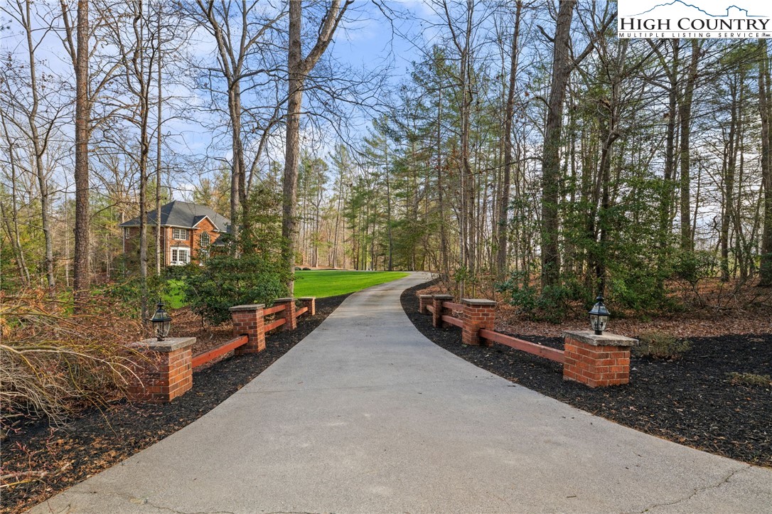 458 Jim Caudill Road Wilkesboro, NC 28697 - Photo 47 of 50 a backyard of a house with lots of green space
