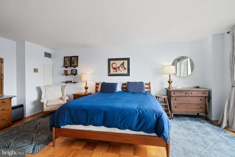 a bedroom with bed and window
