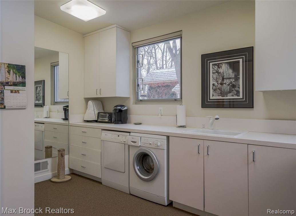 4455 Dow Ridge Road West Bloomfield, MI 48324 - Photo 19 of 50 1st floor laundry with expansive counters can be a prep and service area for entertaining
