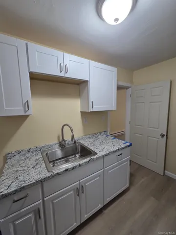 a kitchen with a sink and cabinets