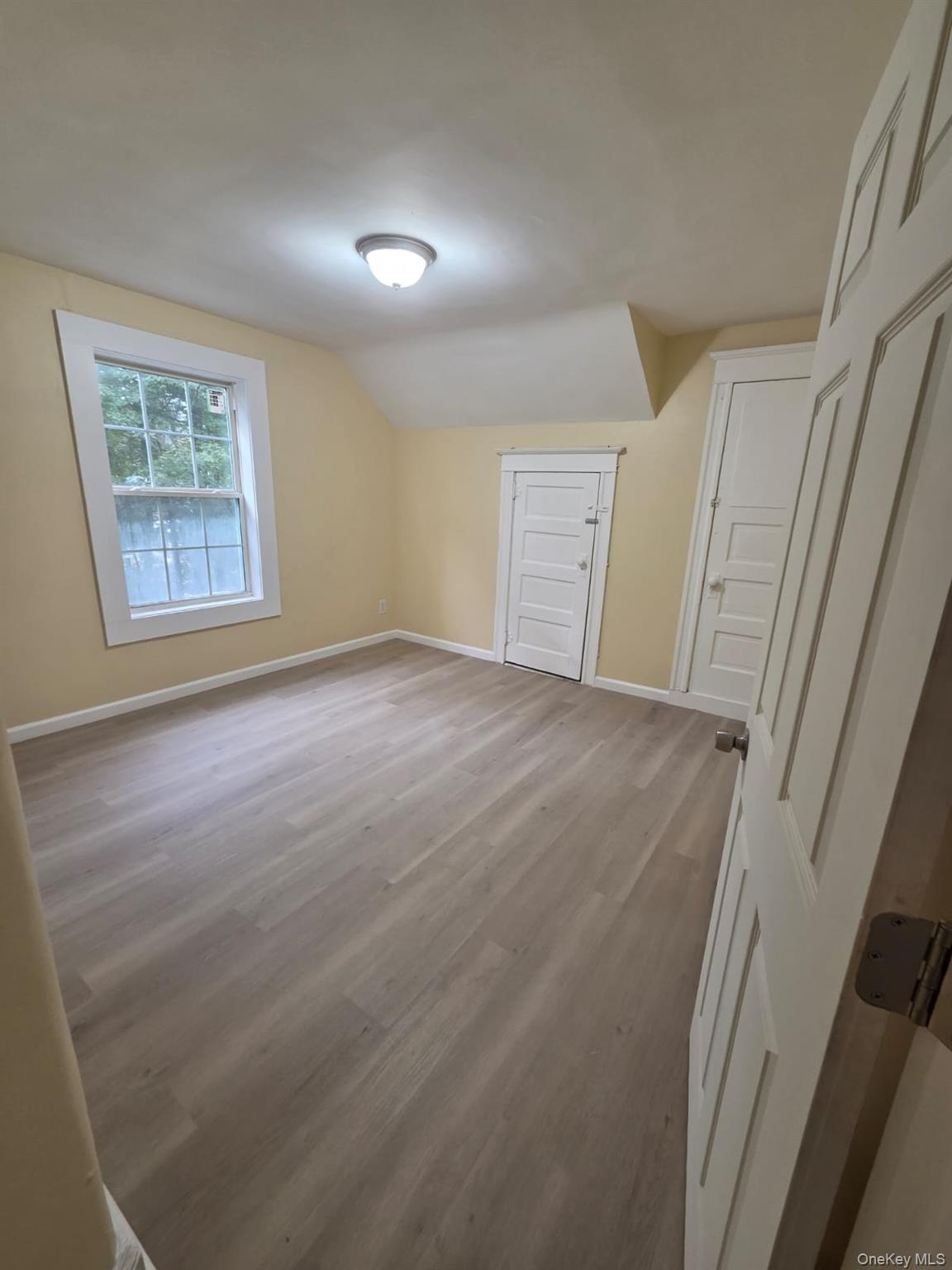 8 Cottage Street, Unit 2 Monticello, NY 12701 - Photo 3 of 5 a view of an empty room with a window