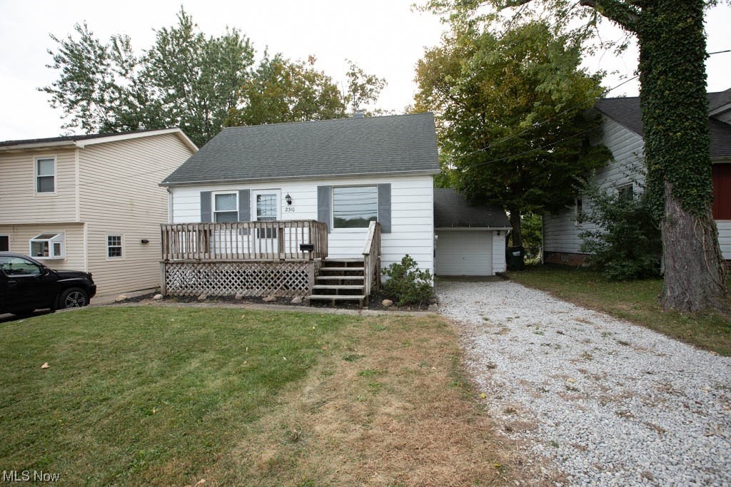 2310 Rockefeller Road Wickliffe, OH 44092 - Photo 1 of 35 View of front facade with a wooden deck and a front yard