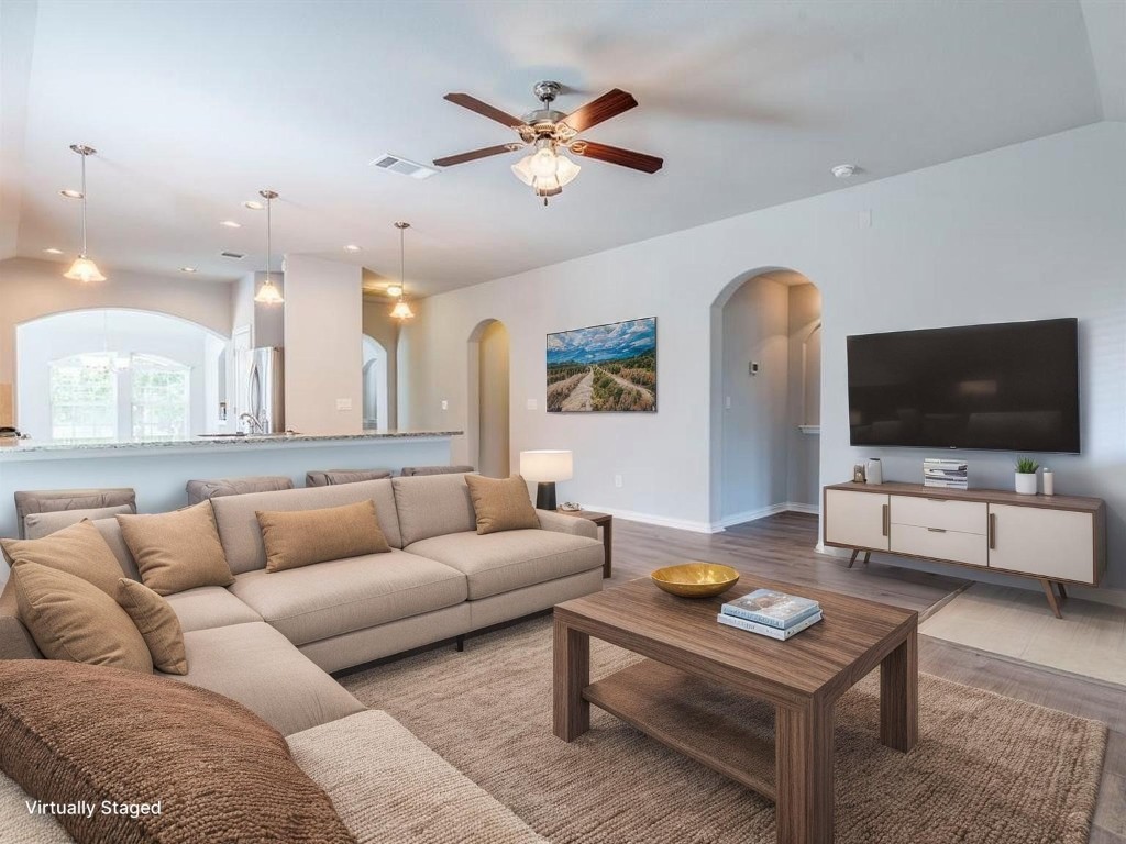 225 Razzmatazz Trail Buda, TX 78610 - Photo 11 of 28 a living room with furniture and a flat screen tv