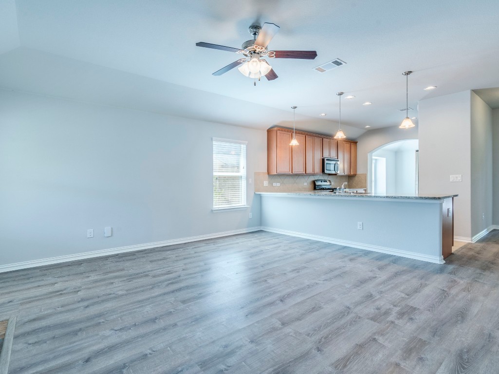 225 Razzmatazz Trail Buda, TX 78610 - Photo 13 of 28 a view of a kitchen with a sink and a window