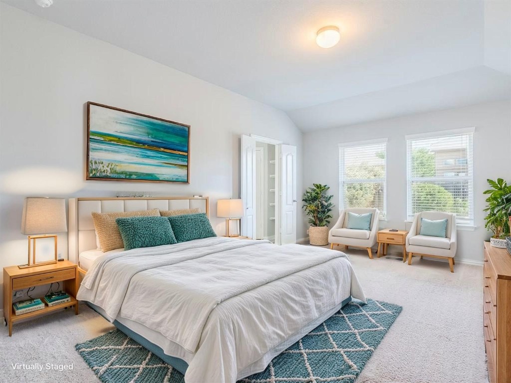 225 Razzmatazz Trail Buda, TX 78610 - Photo 14 of 28 a bedroom with a bed and a couch