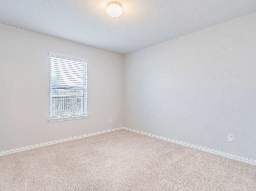 225 Razzmatazz Trail Buda, TX 78610 - Photo 20 of 28 an empty room with a window