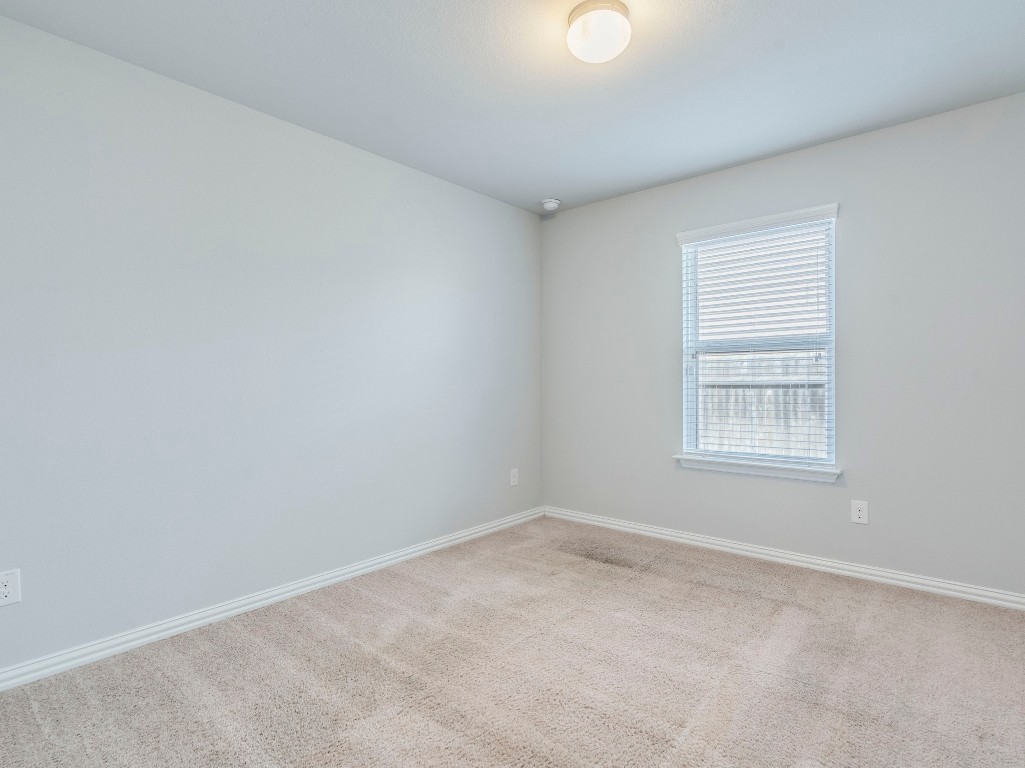 225 Razzmatazz Trail Buda, TX 78610 - Photo 22 of 28 an empty room with a window
