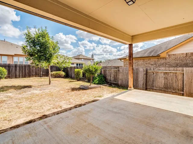 a view of a backyard of a house