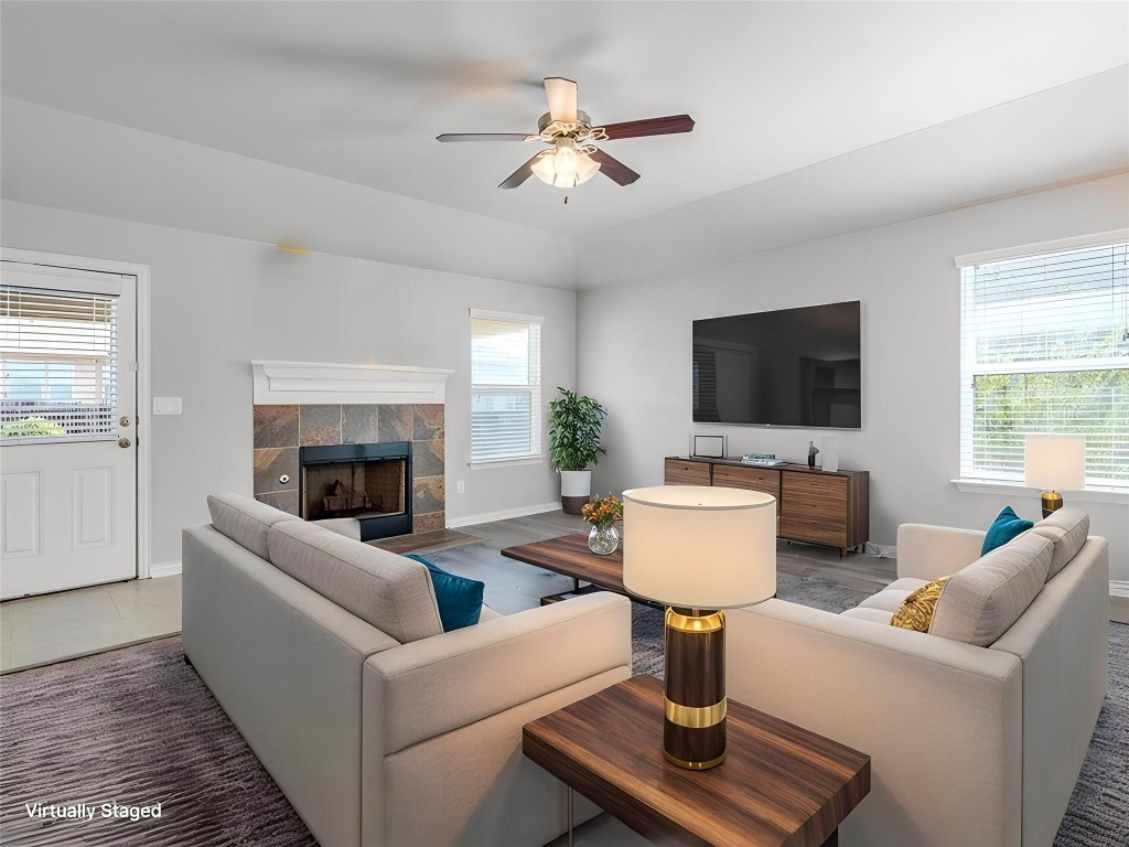 225 Razzmatazz Trail Buda, TX 78610 - Photo 8 of 28 a living room with furniture and a fireplace