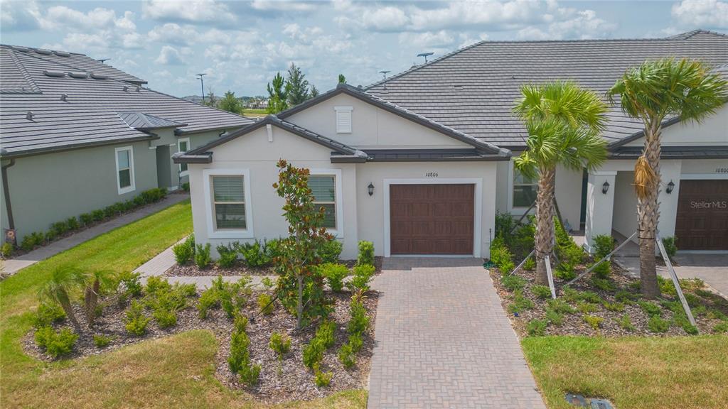 10806 Gable Dig Loop San Antonio, FL 33576 - Photo 45 of 73 a front view of a house with a yard