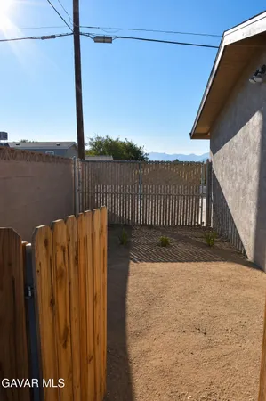 a view of a roof deck with wooden fence