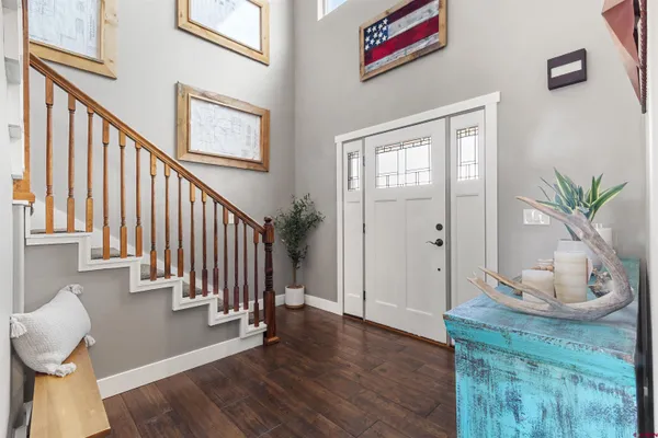 a view of an entryway with wooden floor
