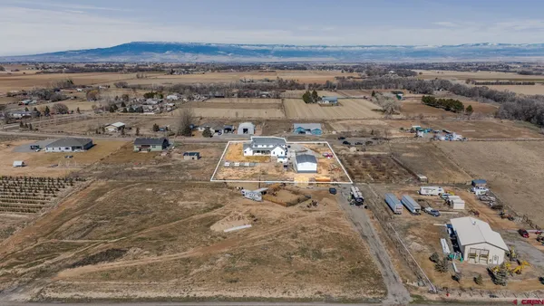 an aerial view of residential building and parking space