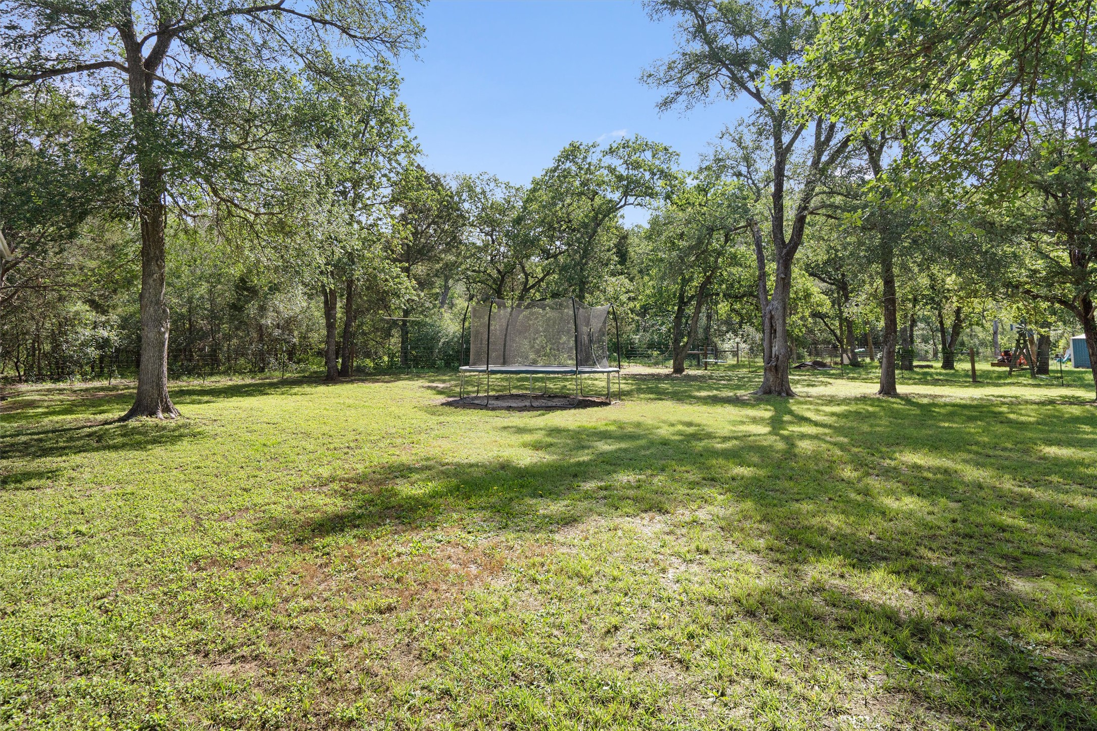 136 Fawn Hollow Elgin, TX 78621 - Photo 37 of 40 Expansive outdoor space featuring mature trees and a substantial grassy area