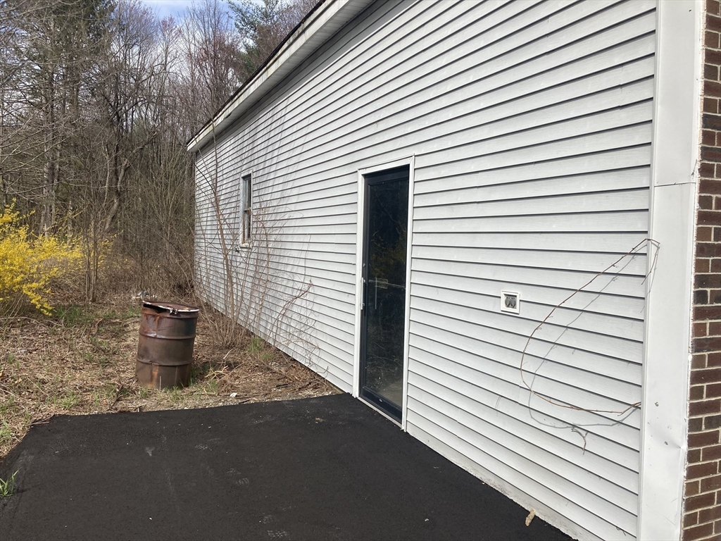 97 Main Street Townsend, MA 01469 - Photo 3 of 10 a view of a porch with a sink