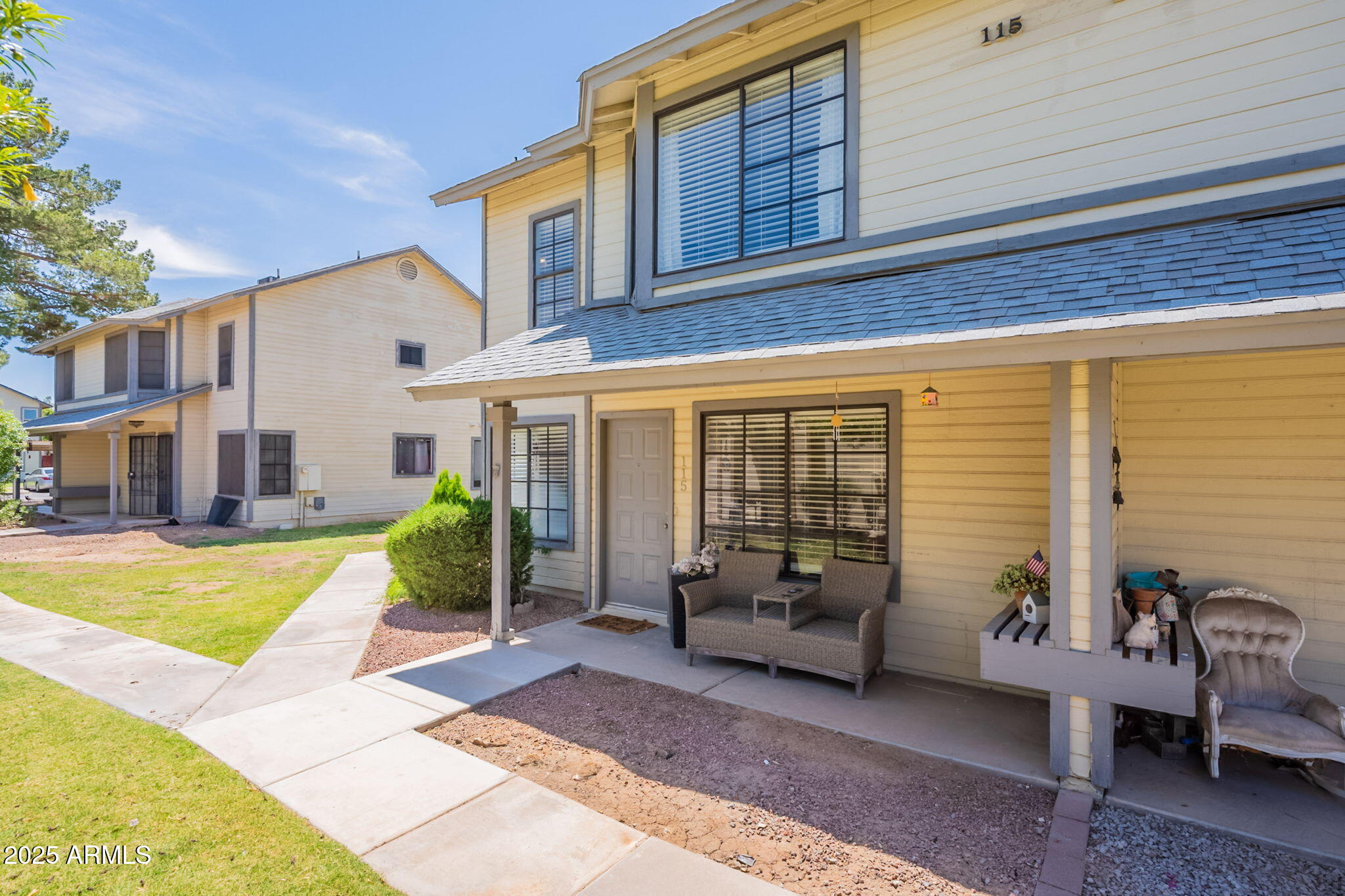 2455 East Broadway Road, Unit 115 Mesa, AZ 85204 - Photo 1 of 17 a view of a house with swimming pool and furniture