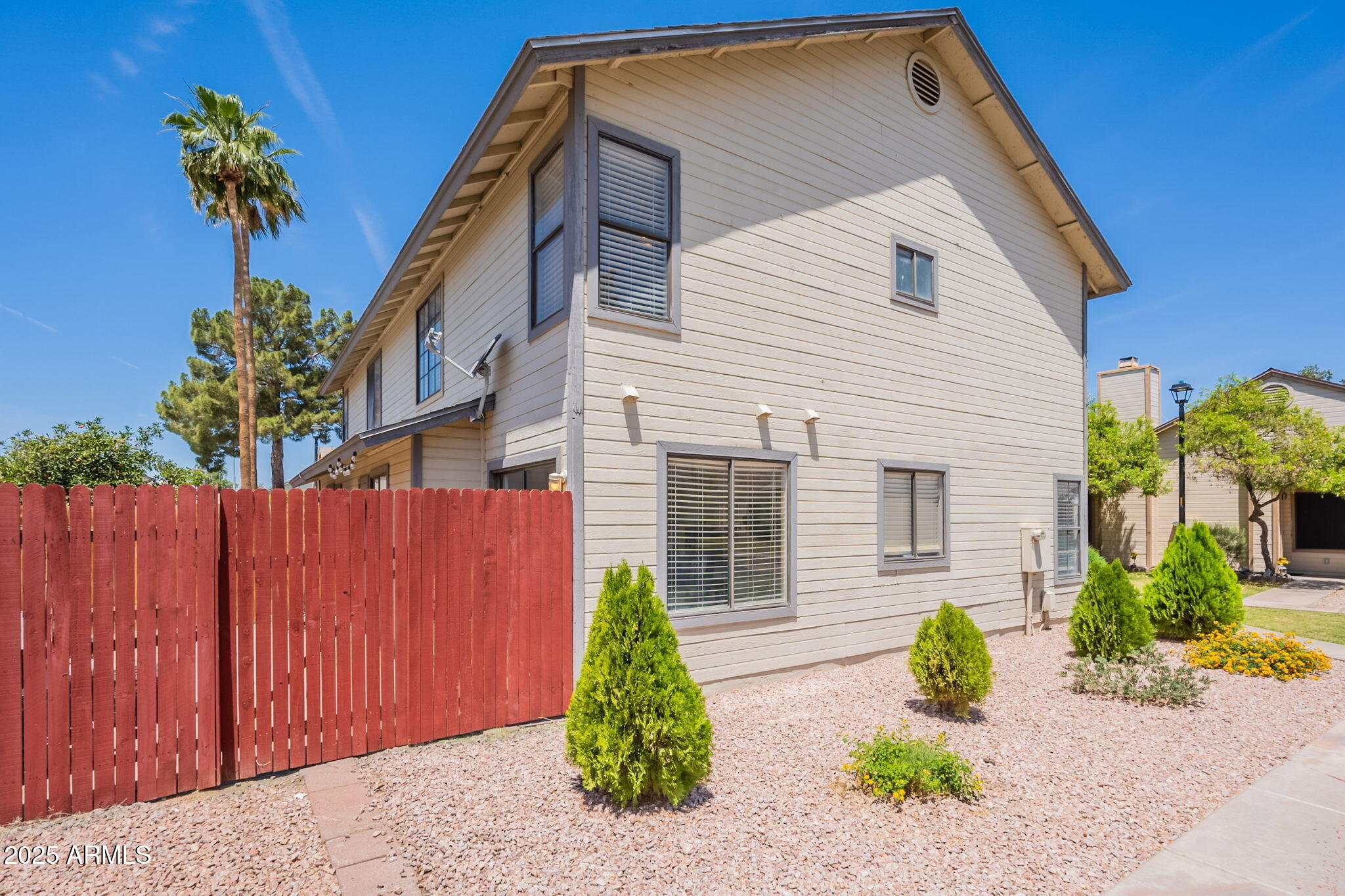 2455 East Broadway Road, Unit 115 Mesa, AZ 85204 - Photo 15 of 17 a front view of a house with a yard