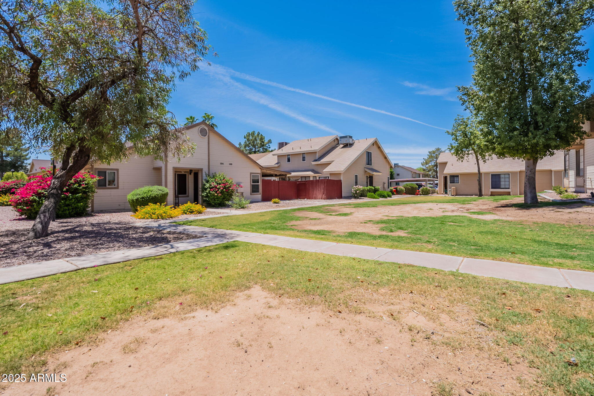 2455 East Broadway Road, Unit 115 Mesa, AZ 85204 - Photo 16 of 17 a view of a house with a yard and sitting area