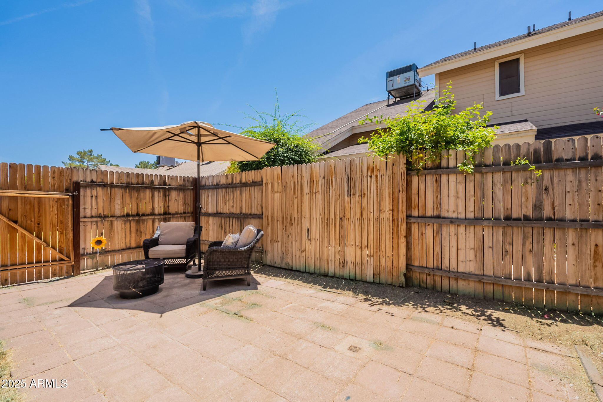 2455 East Broadway Road, Unit 115 Mesa, AZ 85204 - Photo 3 of 17 a view of a dinning table and chairs under an umbrella