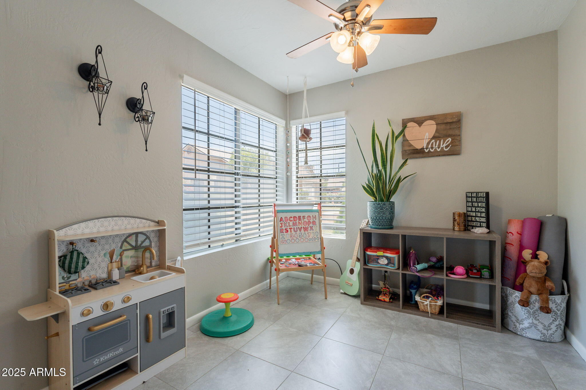 2455 East Broadway Road, Unit 115 Mesa, AZ 85204 - Photo 4 of 17 a living room with furniture a chandelier and a window