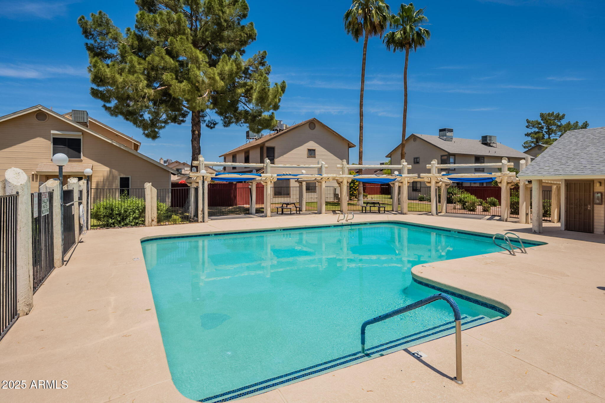 2455 East Broadway Road, Unit 115 Mesa, AZ 85204 - Photo 5 of 17 a front view of a house with garden
