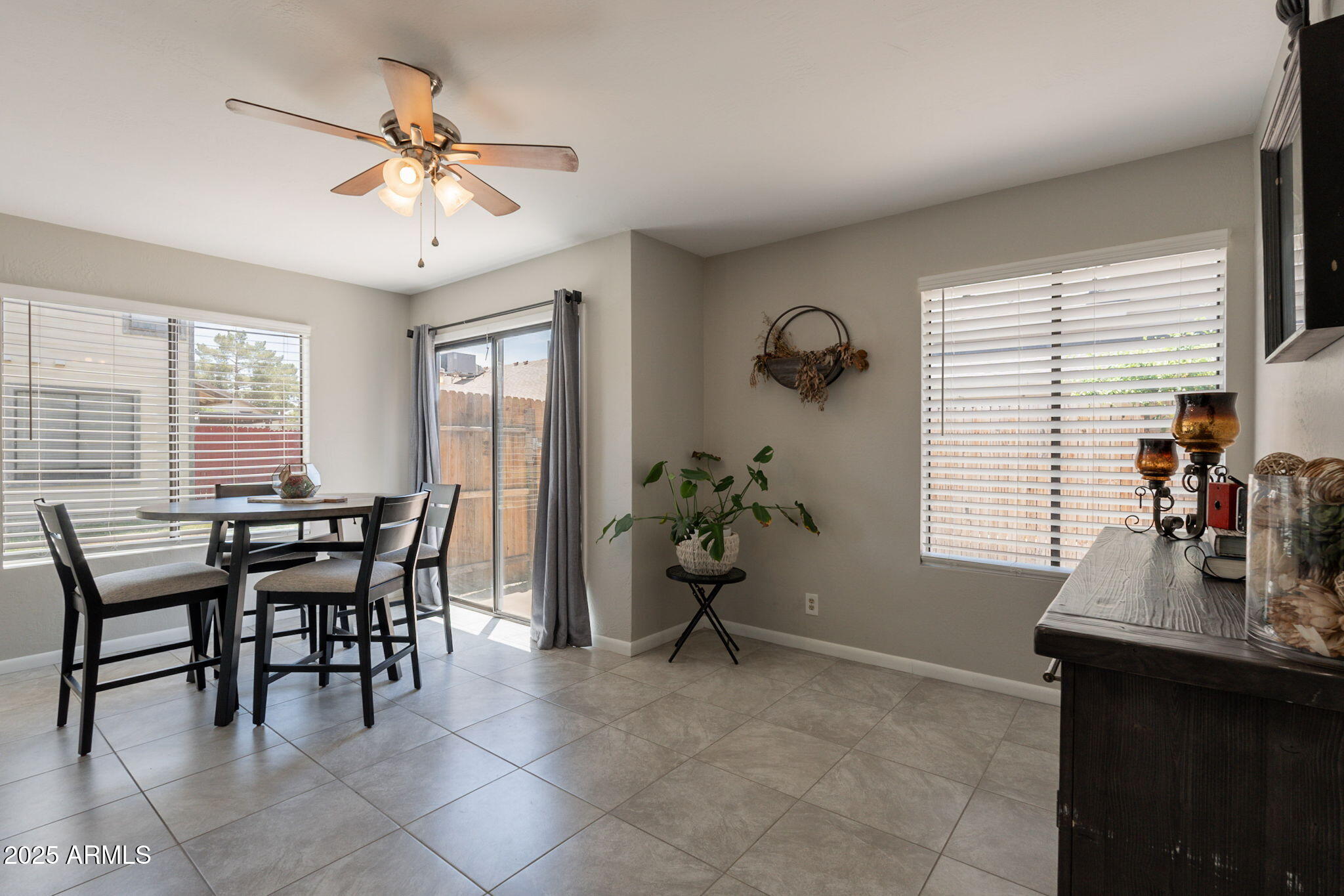 2455 East Broadway Road, Unit 115 Mesa, AZ 85204 - Photo 10 of 17 a dining room with furniture and window