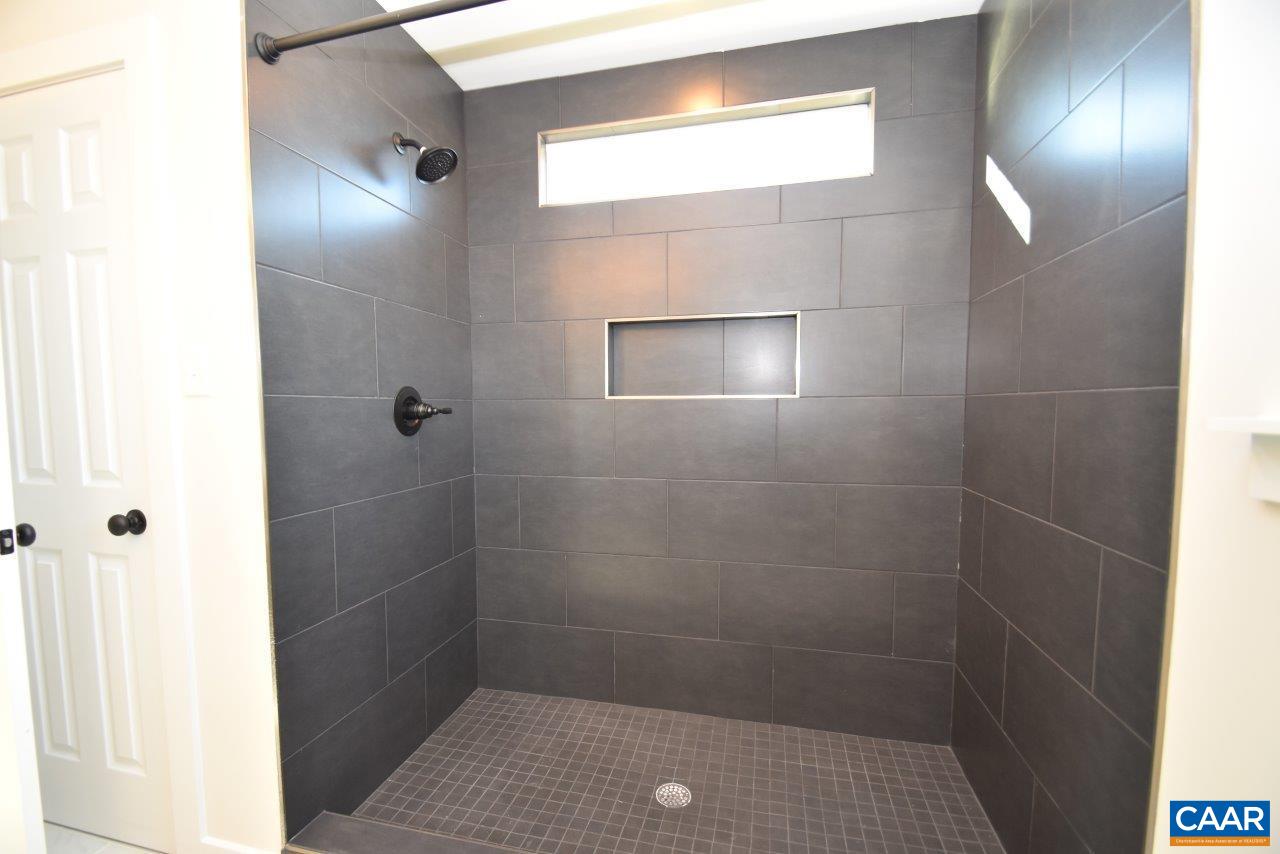 115 Bacon Bit Lane Louisa, VA 23093 - Photo 23 of 29 a bathroom with a shower