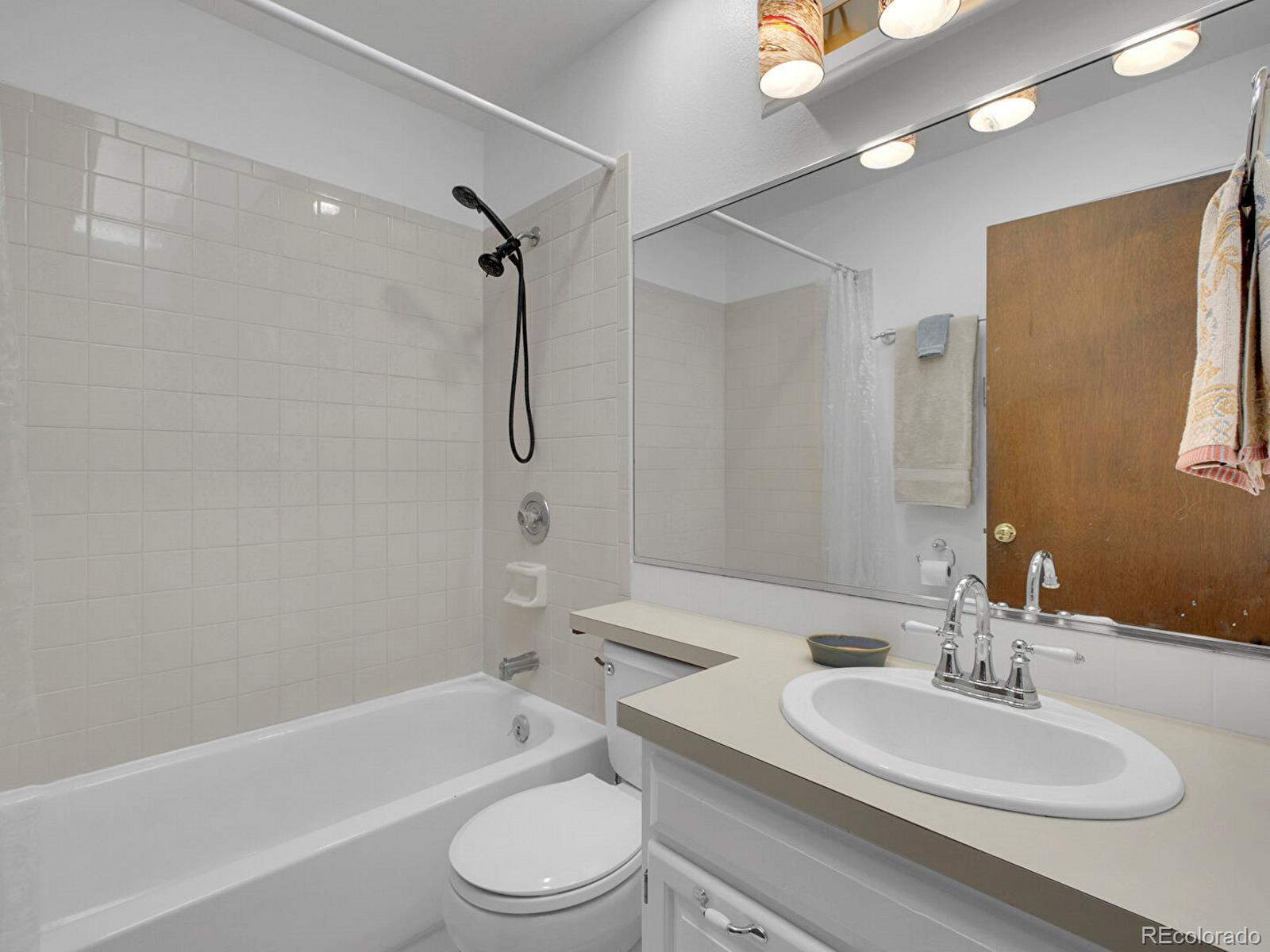 638 Impala Trail Bailey, CO 80421 - Photo 19 of 50 a bathroom with a sink toilet and shower