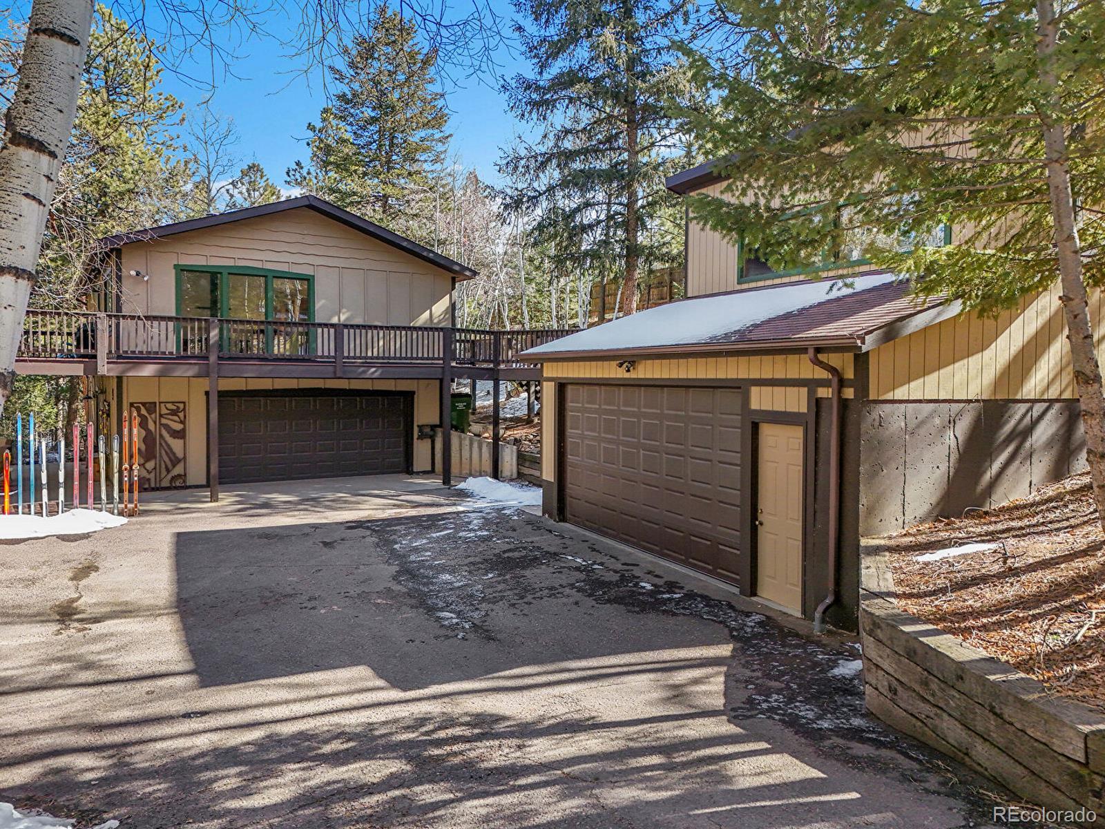 638 Impala Trail Bailey, CO 80421 - Photo 2 of 50 a front view of house with yard