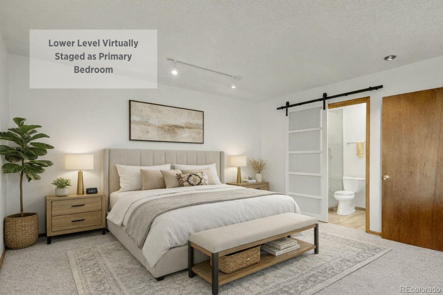 638 Impala Trail Bailey, CO 80421 - Photo 22 of 50 a bedroom with a large bed and a potted plant on the dresser