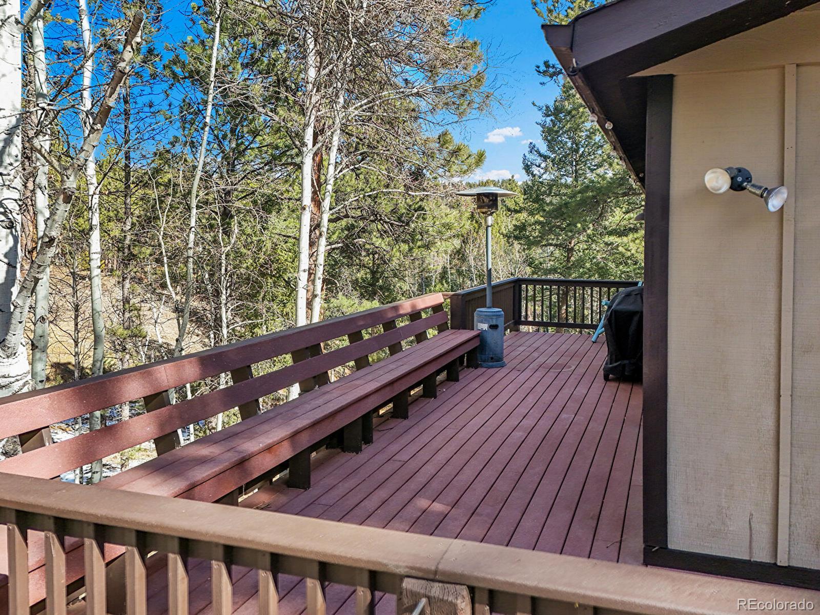 638 Impala Trail Bailey, CO 80421 - Photo 32 of 50 a balcony with wooden floor