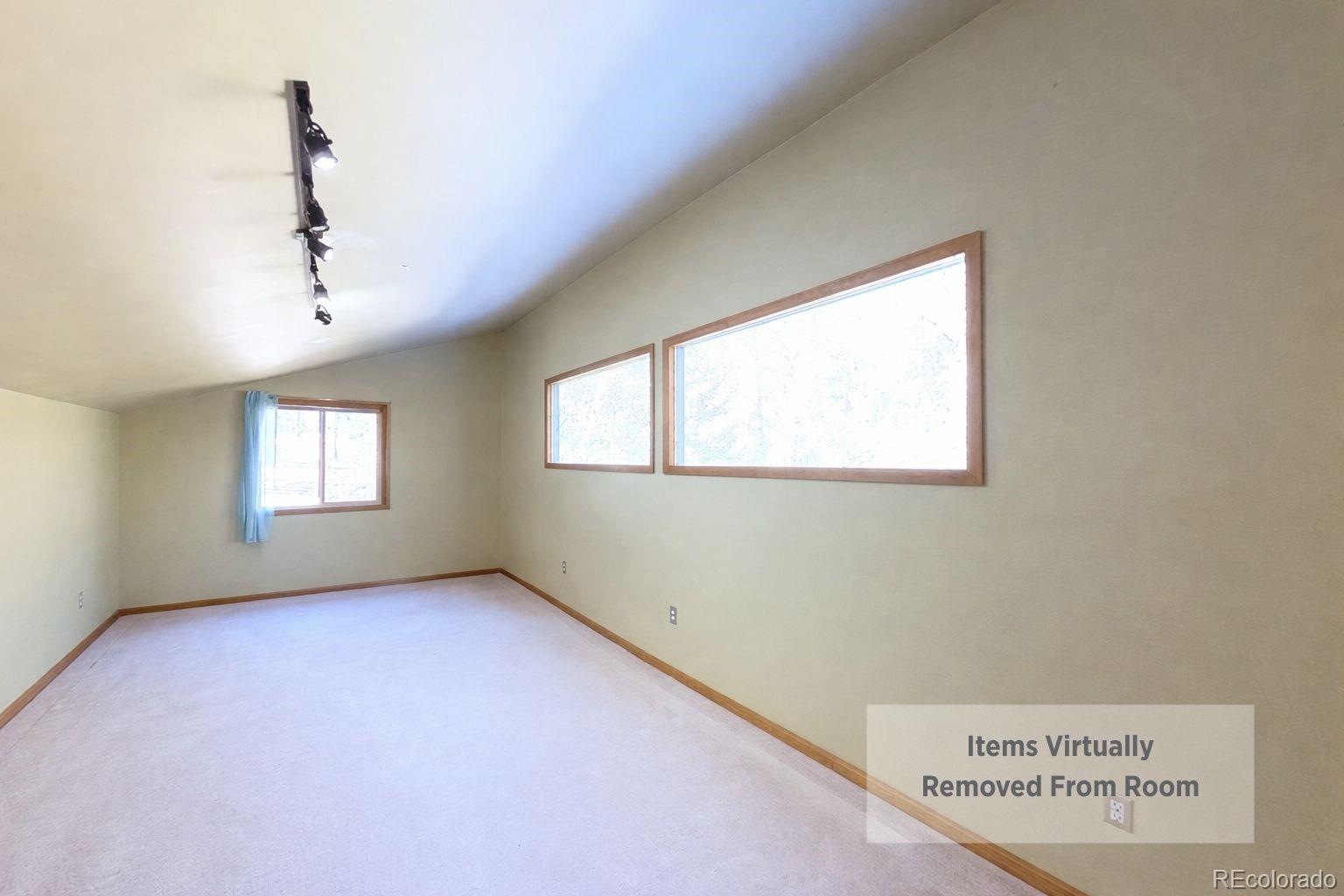 638 Impala Trail Bailey, CO 80421 - Photo 37 of 50 an empty room with windows