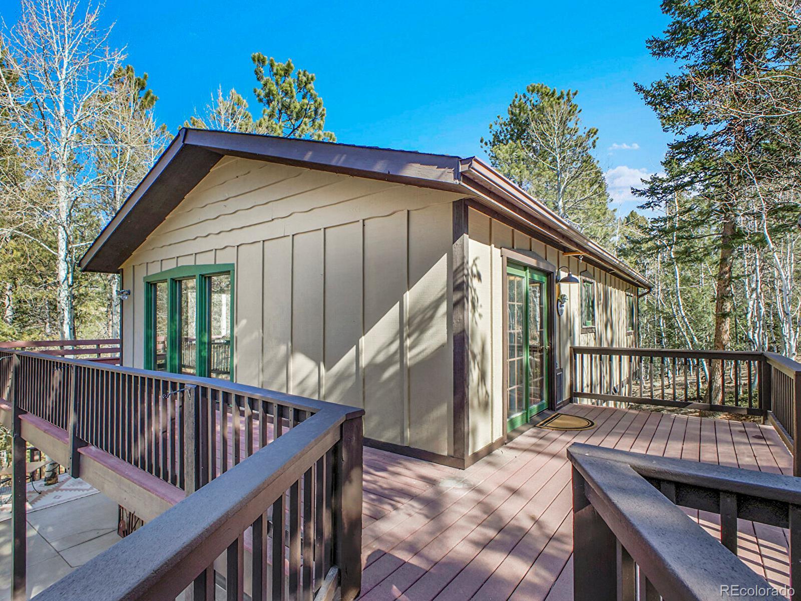 638 Impala Trail Bailey, CO 80421 - Photo 41 of 50 a view of a house with a deck