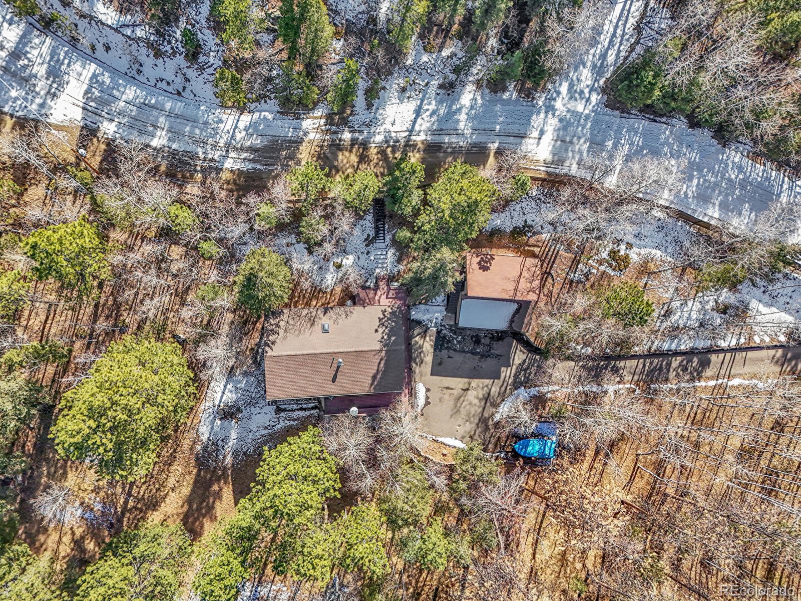 638 Impala Trail Bailey, CO 80421 - Photo 47 of 50 an aerial view of a house with a yard