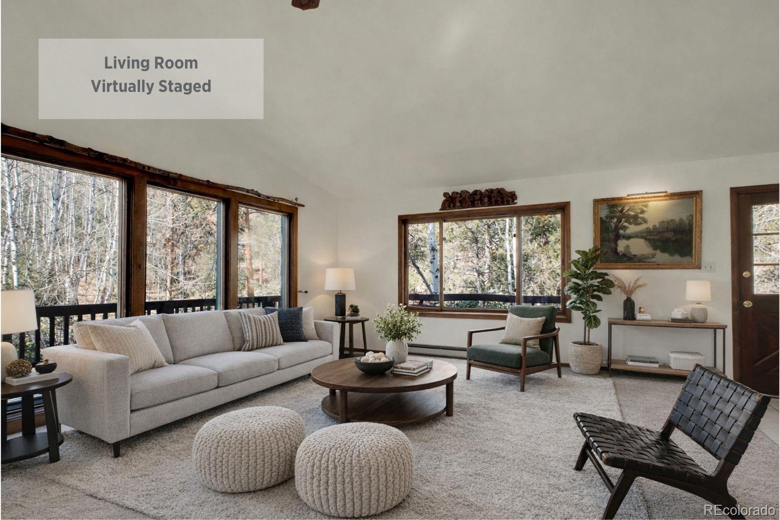 638 Impala Trail Bailey, CO 80421 - Photo 5 of 50 a living room with furniture and a large window