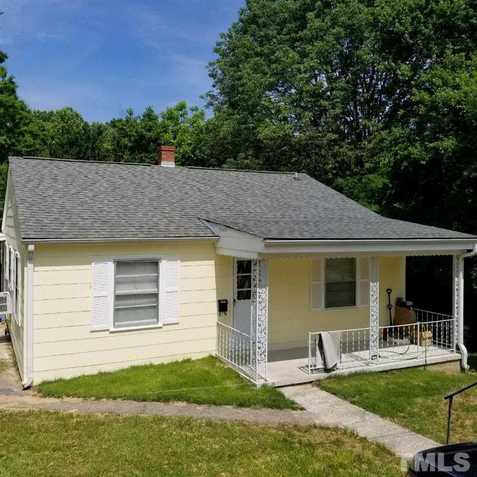 107 Allgood Street Roxboro, NC 27573 - Photo 1 of 12 a front view of house with yard and outdoor seating