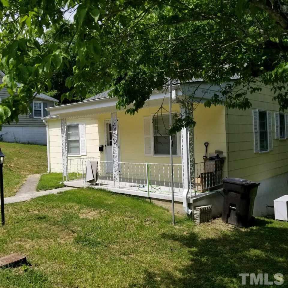 107 Allgood Street Roxboro, NC 27573 - Photo 2 of 12 a view of a house with backyard and sitting area