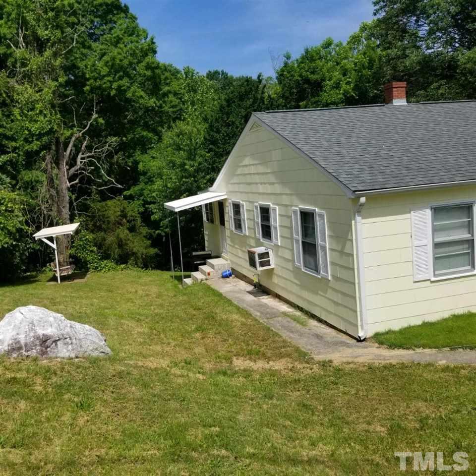 107 Allgood Street Roxboro, NC 27573 - Photo 11 of 12 a view of a house with backyard and sitting area