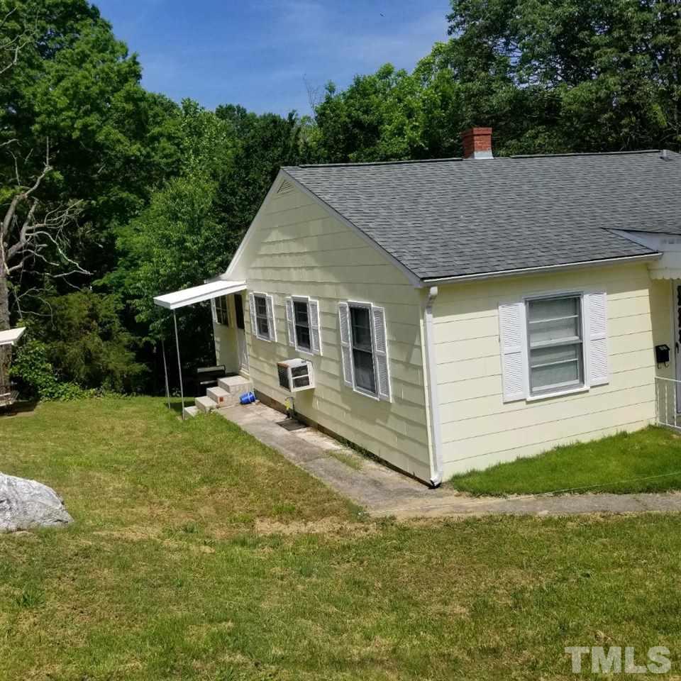 107 Allgood Street Roxboro, NC 27573 - Photo 3 of 12 a view of a house with backyard porch and garden