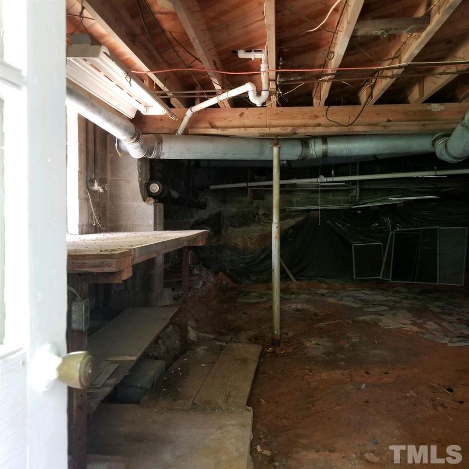 107 Allgood Street Roxboro, NC 27573 - Photo 5 of 12 a room with water heater and a cabinet