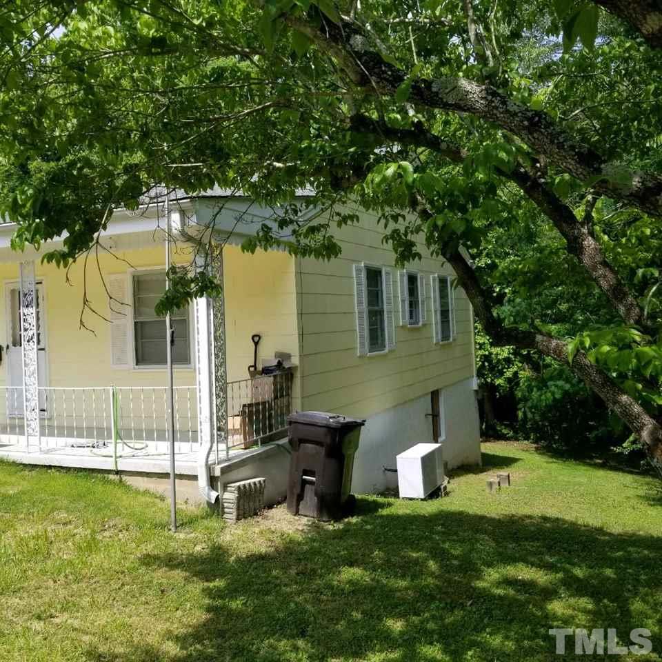 107 Allgood Street Roxboro, NC 27573 - Photo 10 of 12 a view of a house with a backyard