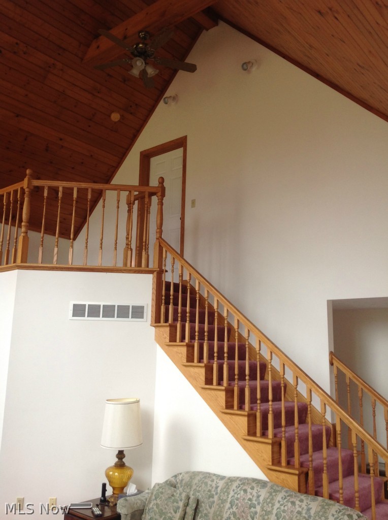 Loft and stairway overlooking the living room provides a nice landing area perfect for a study or small office