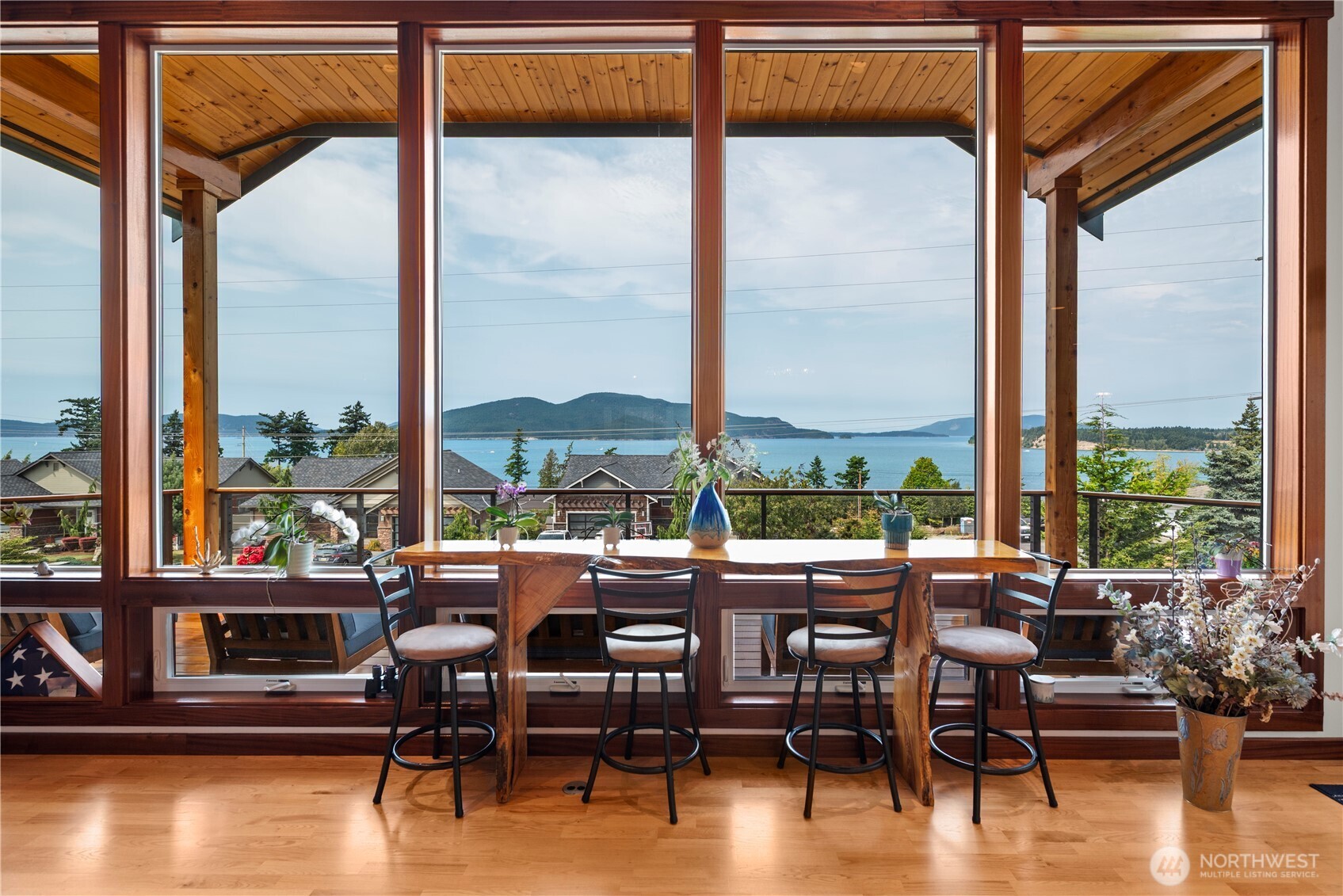 3803 West 2nd Street Anacortes, WA 98221 - Photo 11 of 40 a room with furniture pool view and large windows